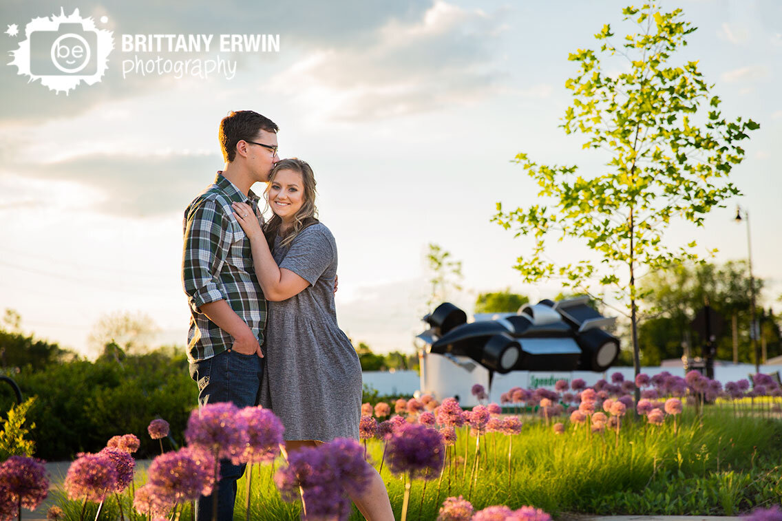 Speedway-Indiana-Indy-Car-sculpture-pink-round-flower-engagement-couple-engaged-photographer.jpg