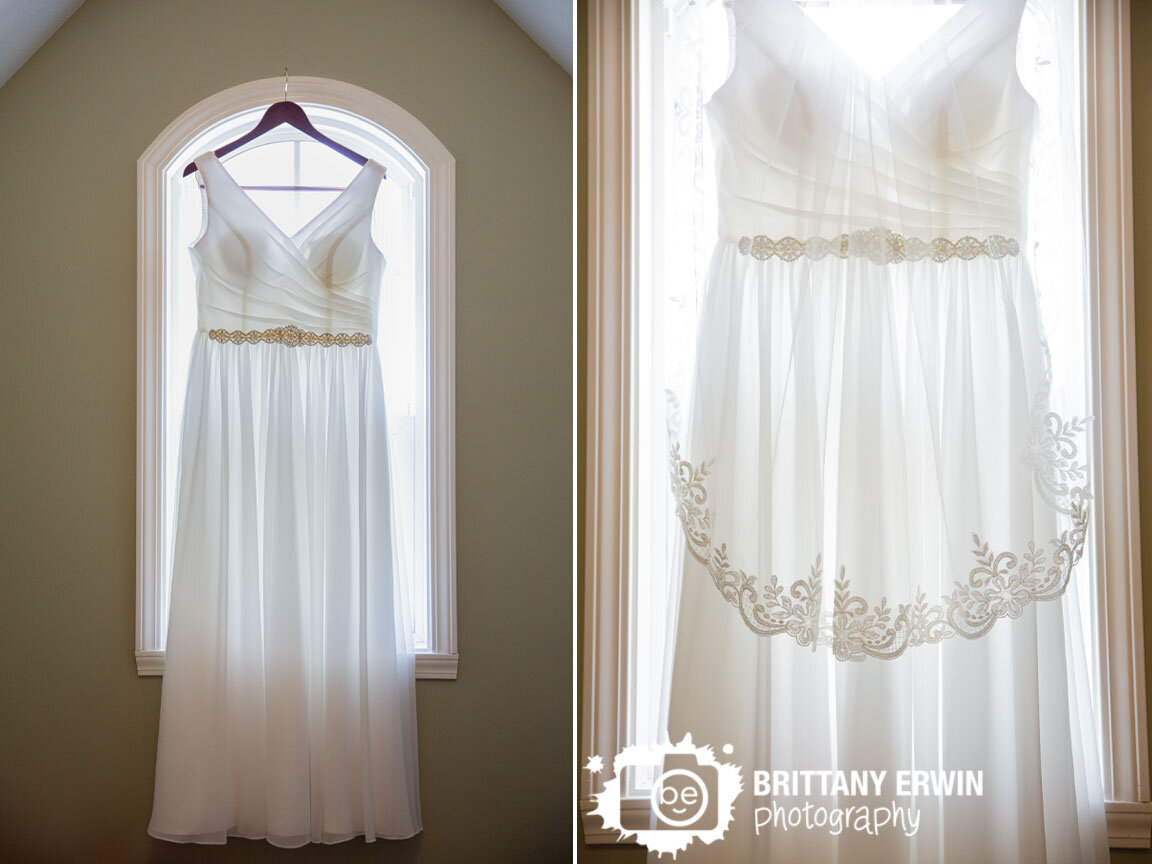Indiana-wedding-photographer-dress-detail-hanging-in-window-backlit-with-veil.jpg