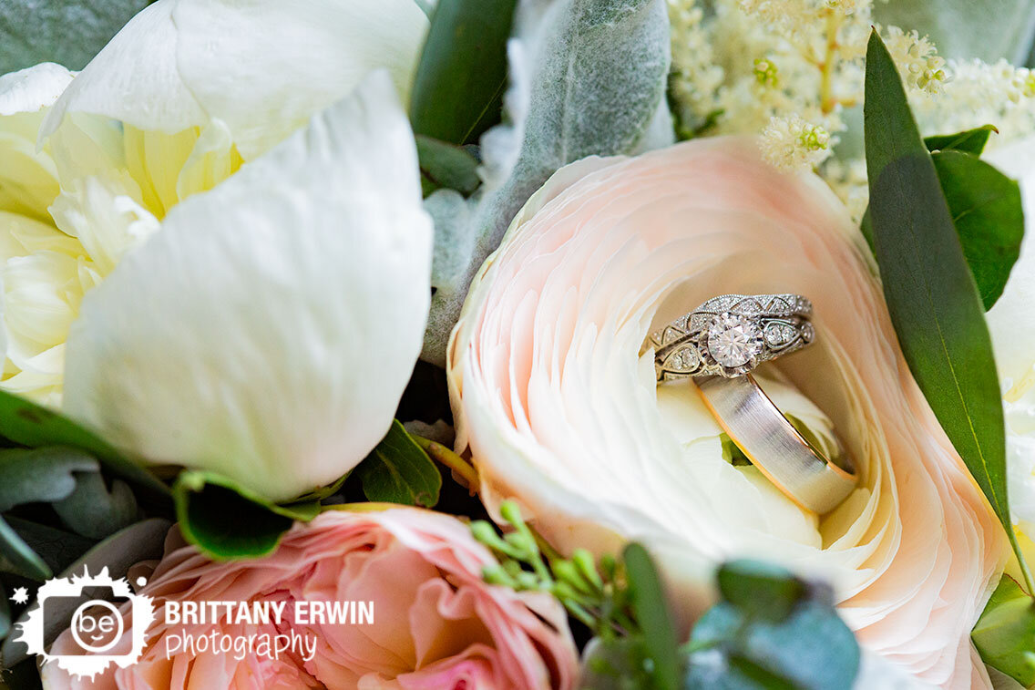 Indianapolis-wedding-details-photographer-rings-engagement-band-in-bride-bouquet-flower.jpg