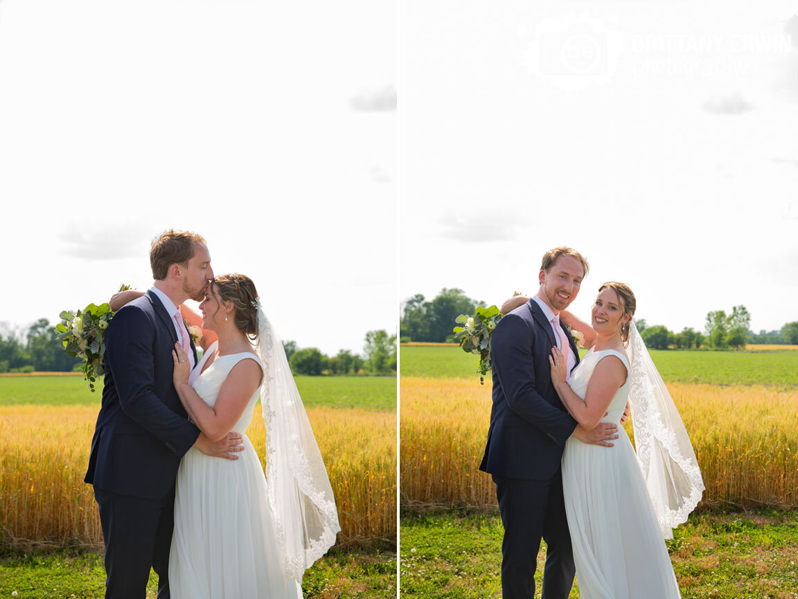 Indianapolis-wedding-photographer-bridal-portrait-bride-groom-by-hay-field-forehead-kiss.jpg