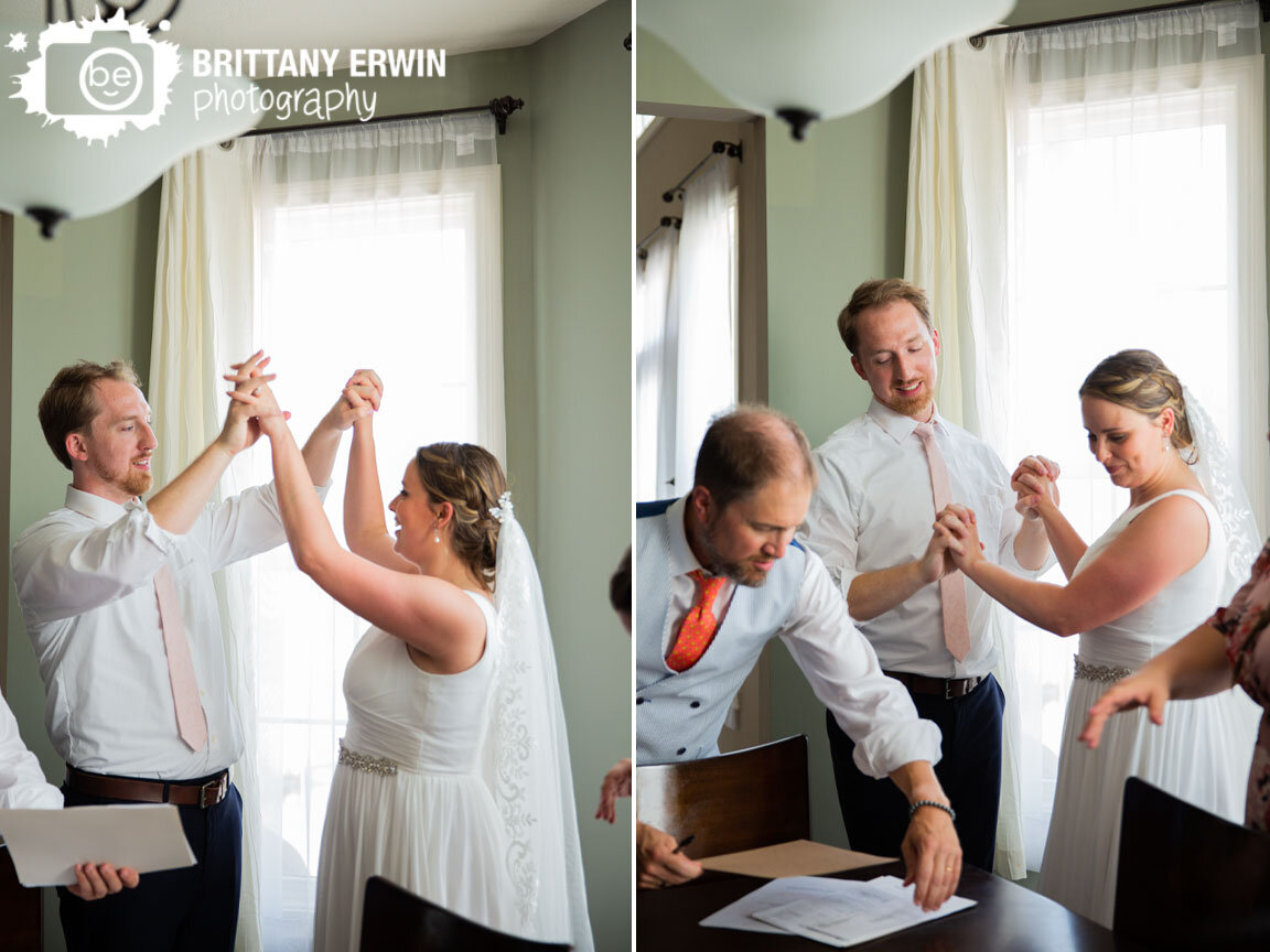 Indianapolis-backyard-wedding-photographer-couple-sign-license-high-five.jpg