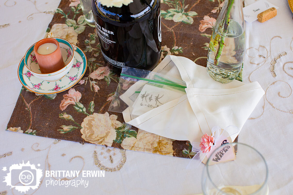 Table-setting-lace-tablecloth-wine-corn-name-card-hand-wipes-growler-flower-vase.jpg