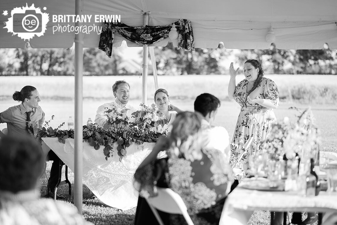 Indianapolis-wedding-reception-photographer-outdoor-tent-bridesmaid-speech-bride-groom-reaction.jpg