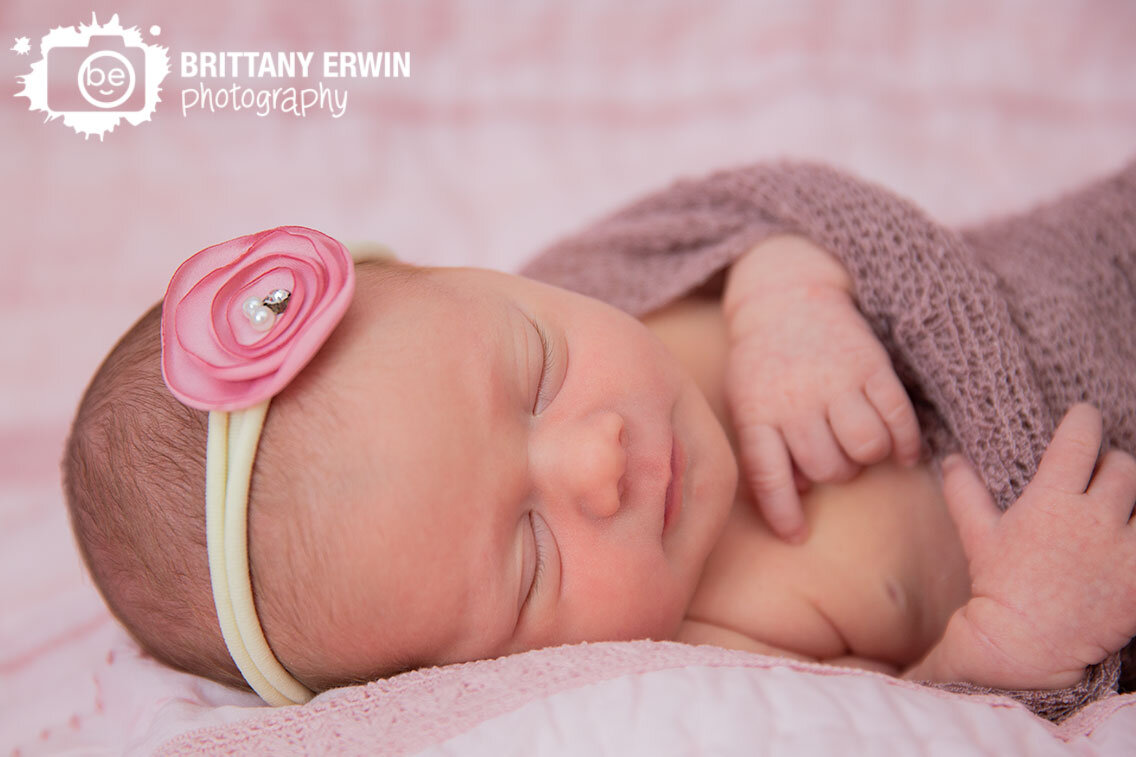 Indianapolis-portrait-photographer-newborn-sleeping-girl-wrapped-with-flower-headband.jpg