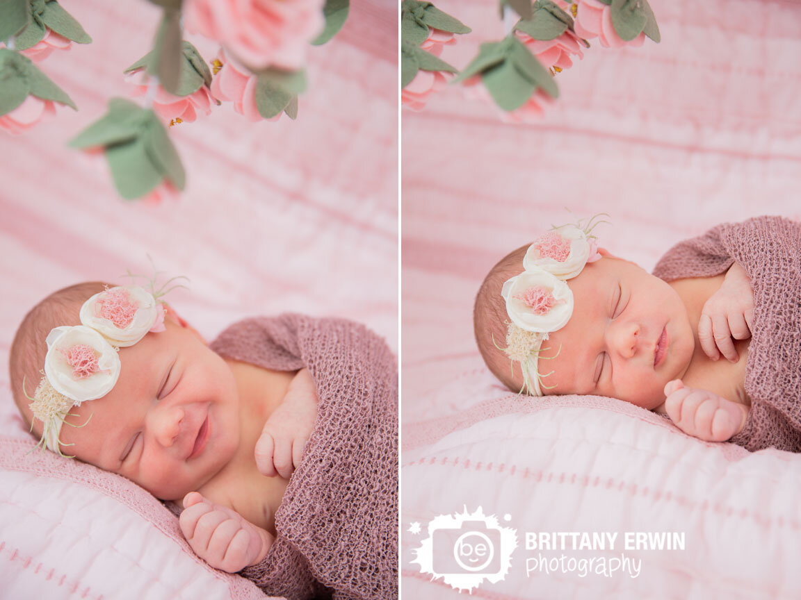 Indianapolis-newborn-portrait-photographer-sleeping-baby-girl-flower-headband-and-mobile.jpg