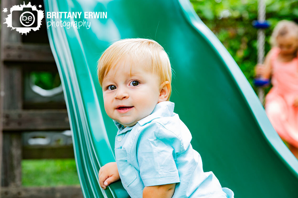 Outdoor-backyard-portrait-photographer-baby-boy-playing-on-playground.jpg
