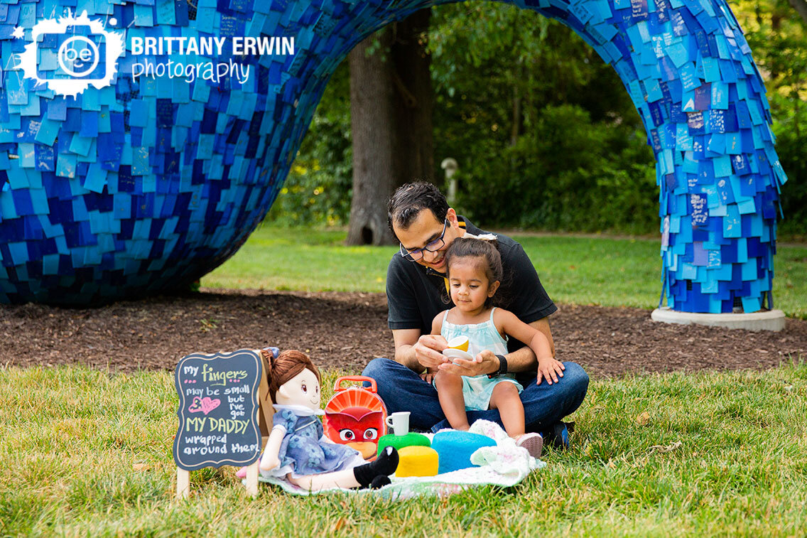 Father-daughter-playing-tea-time-picnic-blanket-indianapolis-art-center.jpg