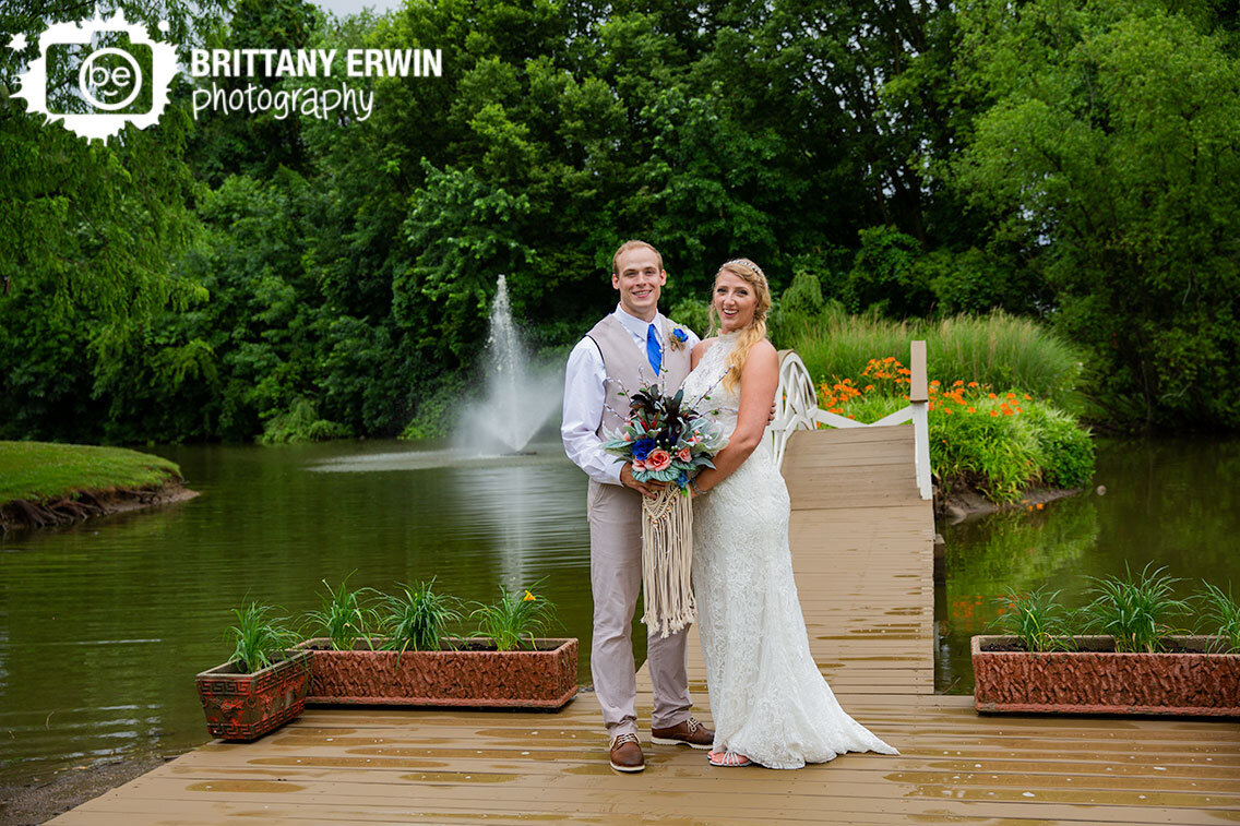 Indianapolis-wedding-photographer-couple-near-bridge-fountain-pond.jpg