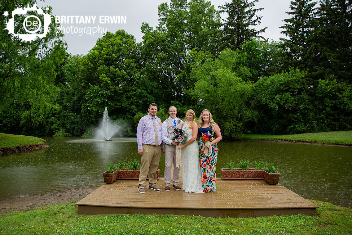 Greenwood-Indiana-wedding-photographer-bridal-party-portrait-by-water-couple-on-dock.jpg