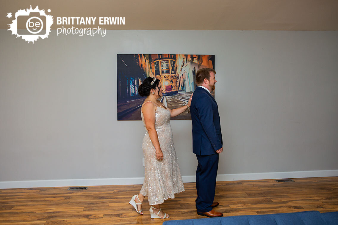 bride-tapping-groom-on-the-shoulder-for-first-look.jpg