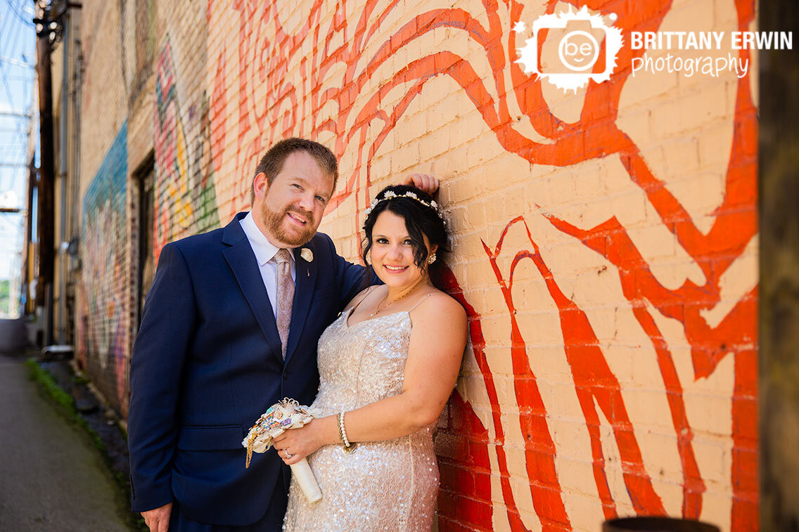 Lafayette-Indiana-wedding-photographer-bride-groom-portrait-with-graffiti-street-art-painting.jpg