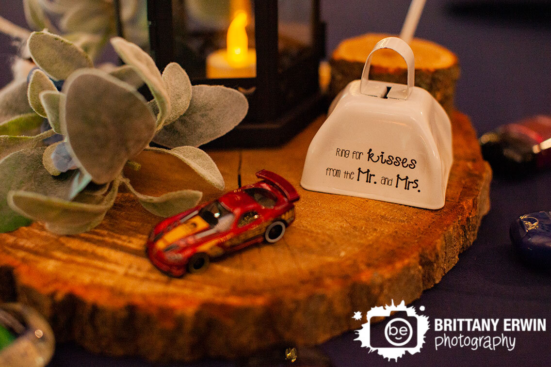 Wedding-photographer-centerpiece-hotwheels-car-with-wood-slice-lantern.jpg