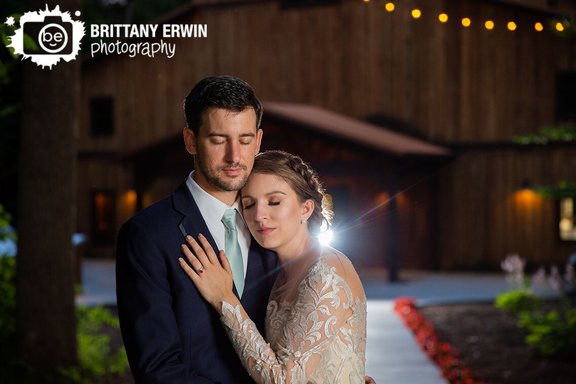 Greencastle-Indiana-wedding-photographer-barn-3-fat-labs-couple-outside-dusk-with-lights.jpg