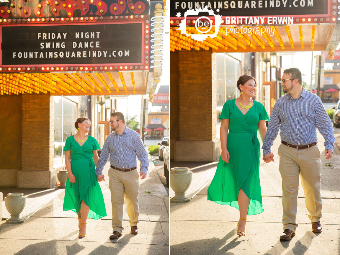 Fountain-Square-theatre-engagement-portrait-photographer-couple-walking-with-marquee.jpg