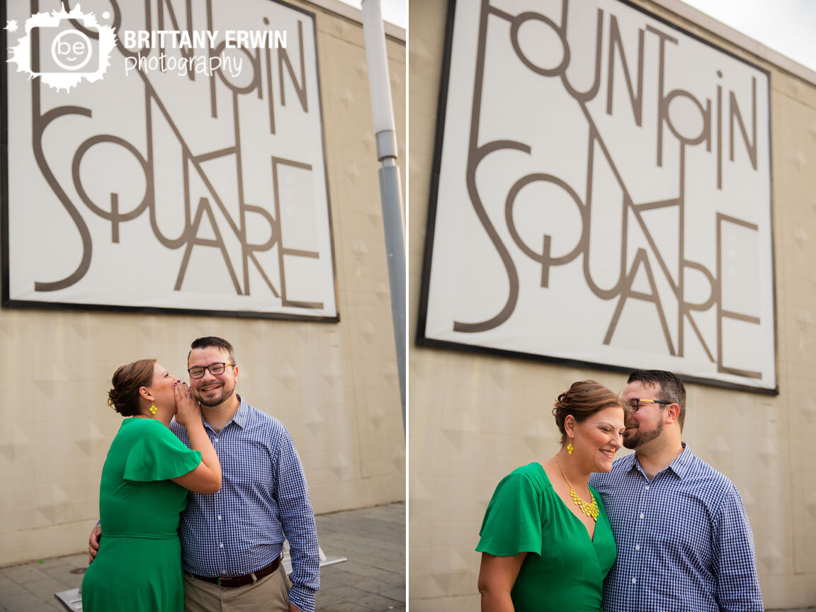 Fountain-Square-Indiana-engagement-portrait-photographer-couple-with-sign.jpg