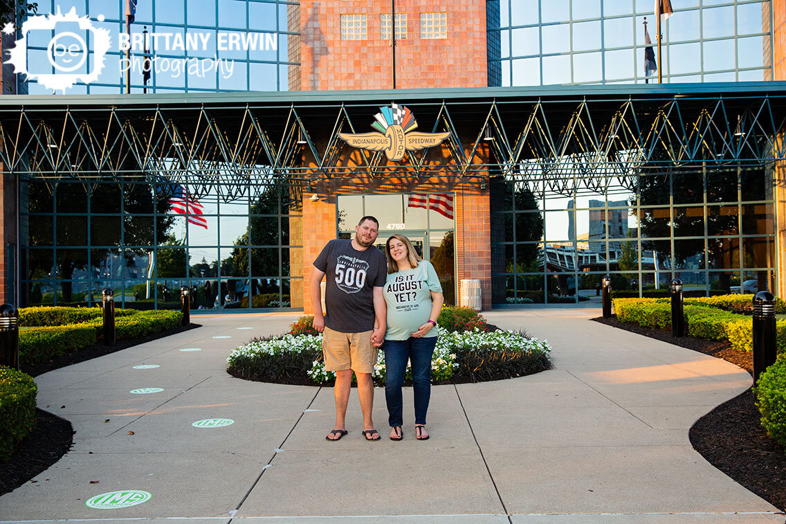 Indianapolis-Motor-Speedway-maternity-portrait-photographer-couple-in-front-of-IMS-building.jpg