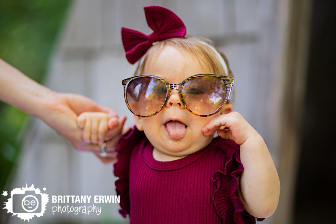 silly-face-milestone-baby-girl-portrait-sunglasses-Indianapolis-Art-Center.jpg