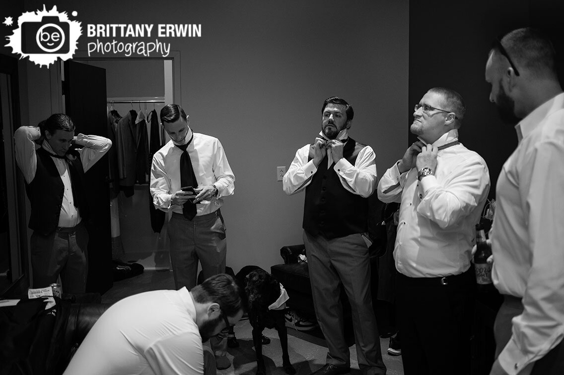 groom-getting-ready-putting-on-bow-tie.jpg
