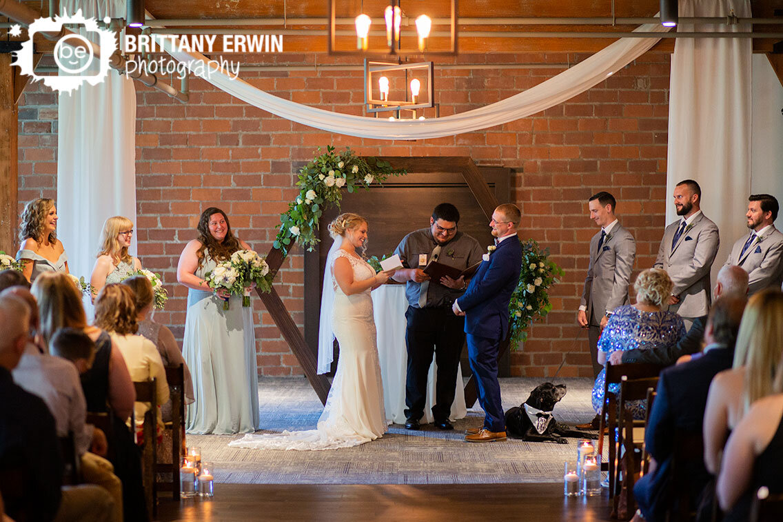 Indiana-wedding-photographer-ceremony-bride-reading-vows-laughing-reaction.jpg