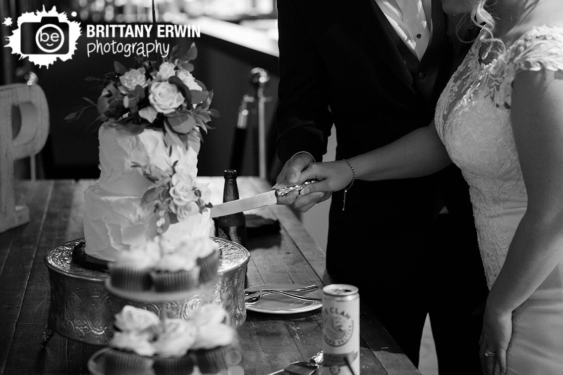 couple-cutting-cake-at-wedding-reception.jpg
