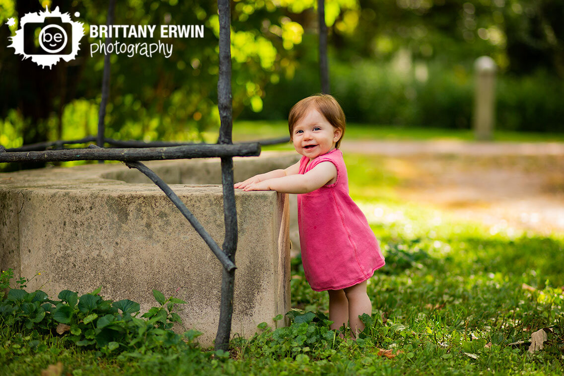 baby-girl-standing-up-in-park-Indianapolis-Art-Center-summer-portrait-photographer.jpg