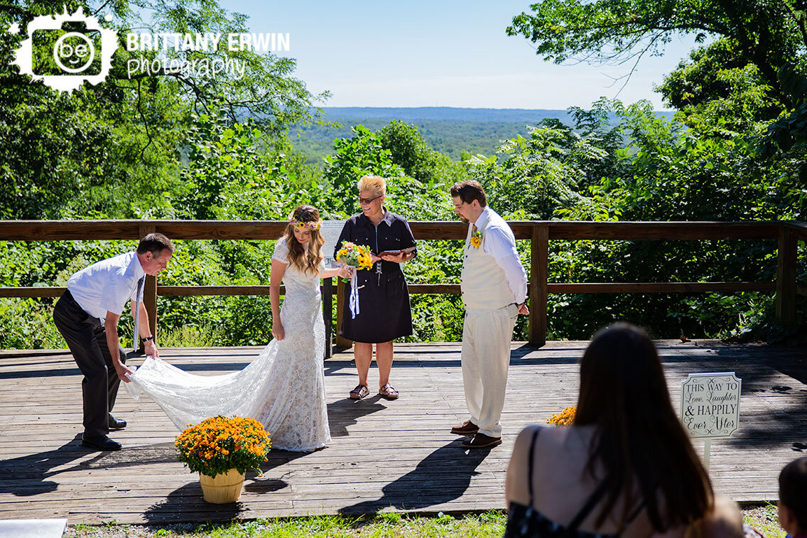 Brown-County-wedding-photographer-father-of-bride-straightening-dress.jpg