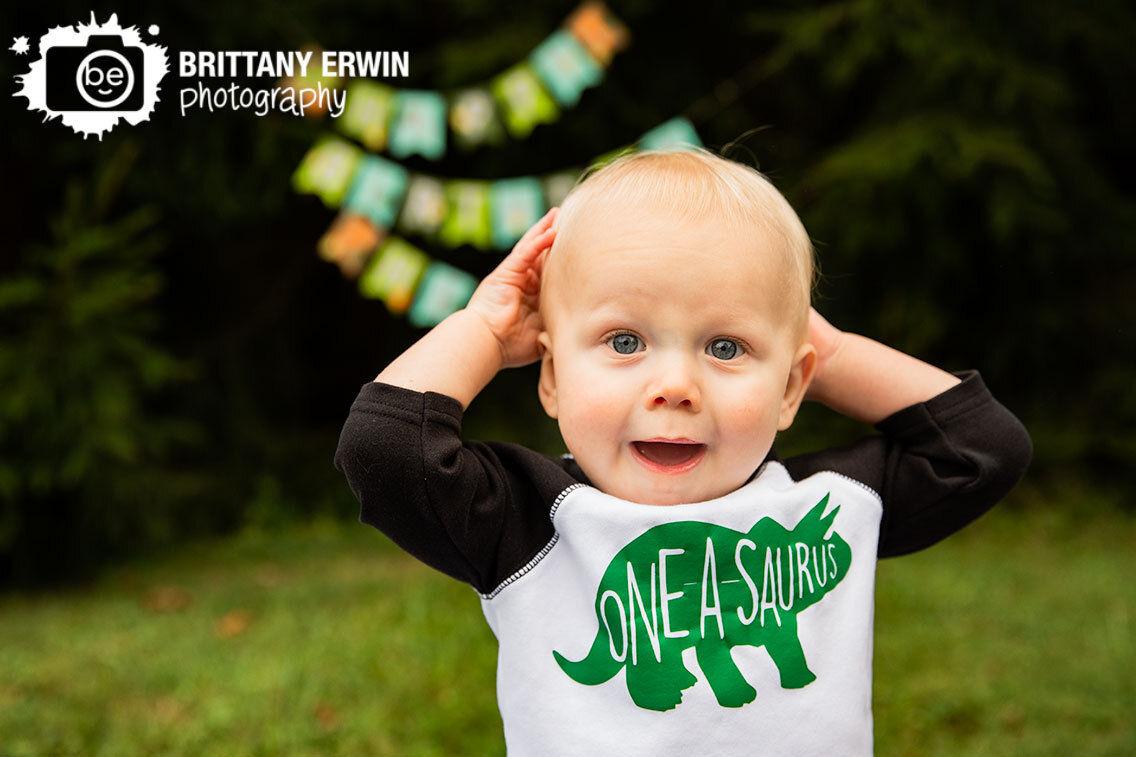 Indianapolis-portrait-photographer-one-a-saurus-first-birthday-boy-silly-face-surprised.jpg