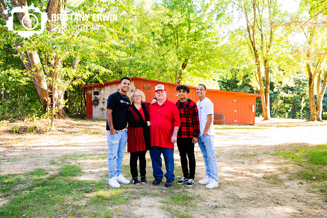 Family-portrait-grandparents-grandsons-outdoor-fall-barn.jpg