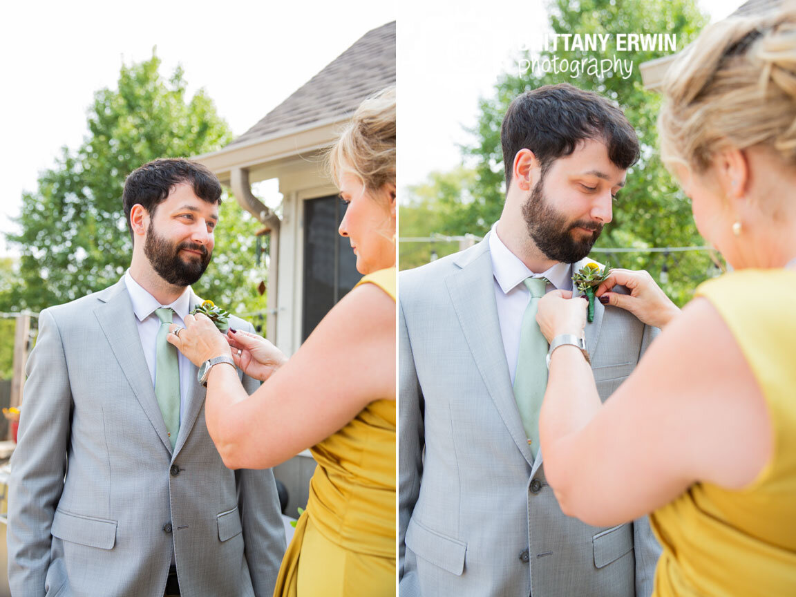 Indianapolis-wedding-photographer-groom-getting-boutonniere-pinned-on.jpg