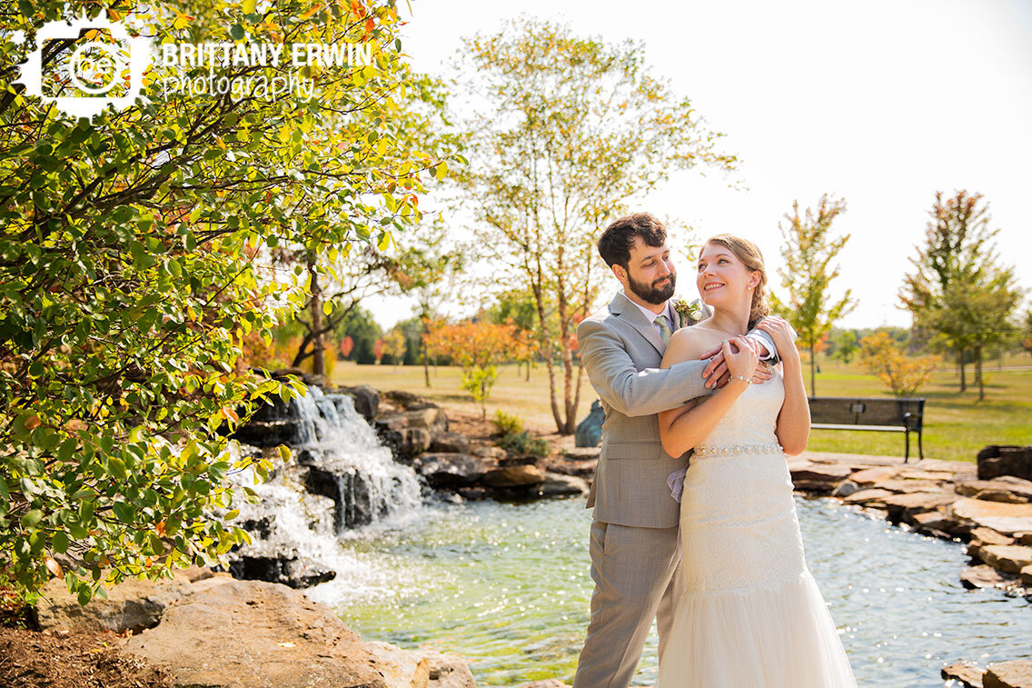 Indianapolis-wedding-photographer-couple-at-waterfall-in-Coxhall-Gardens-fall.jpg