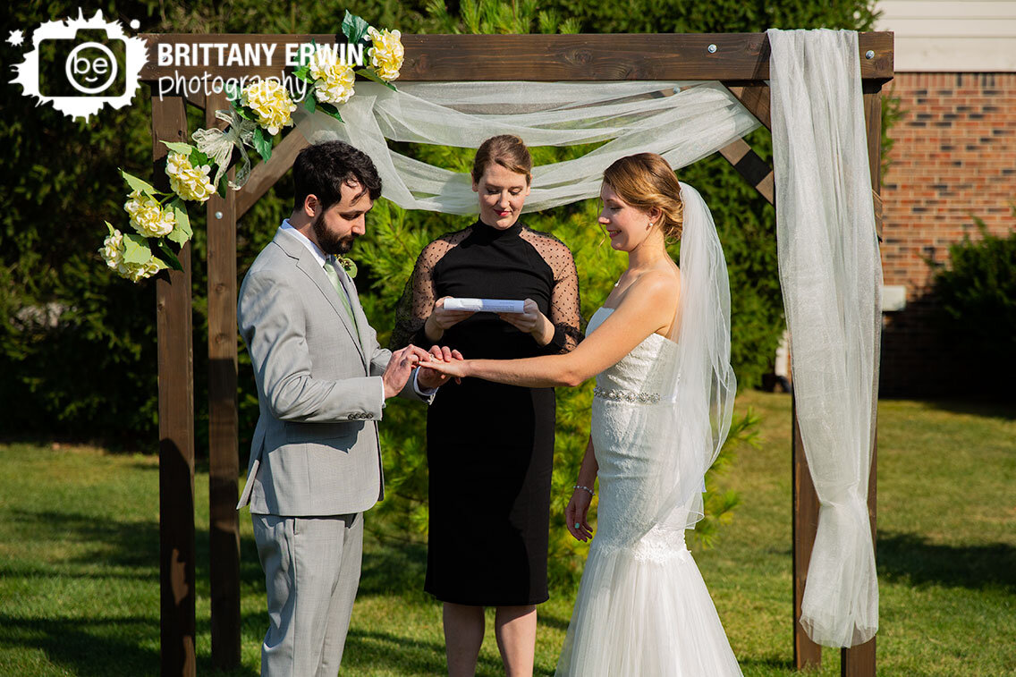 Indianapolis-wedding-photographer-exchange-rings-outdoor-ceremony.jpg