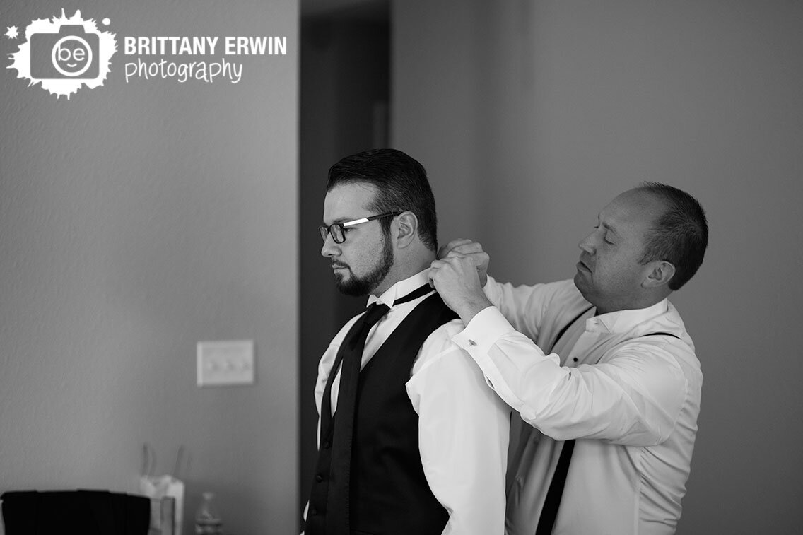 groom-getting-ready-best-man-straightening-tie.jpg