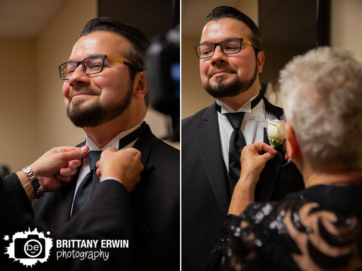 groom-getting-ready-mother-pinning-on-boutonniere.jpg