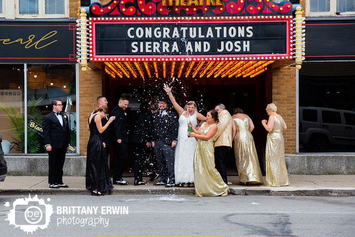 Fountain-Square-Theatre-wedding-photographer-bride-groom-with-bridal-party-champagne-spray.jpg