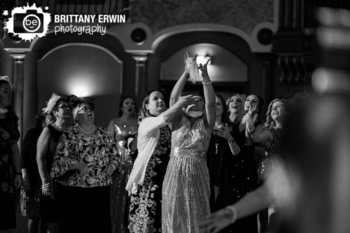 Indianapolis-wedding-photographer-bridesmaid-catching-bouquet-at-reception.jpg