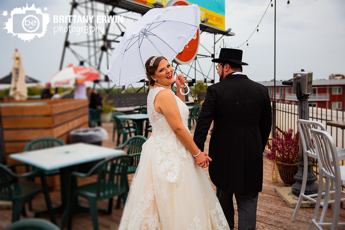 Fountain-Square-Theatre-rooftop-couple-umbrella-wedding-photographer.jpg