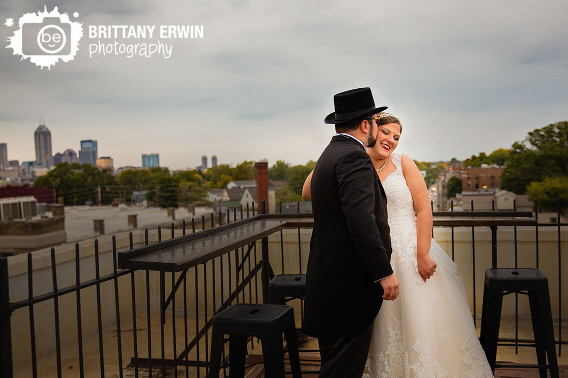 rainy-skyline-wedding-bridal-portrait-couple-on-rooftop.jpg