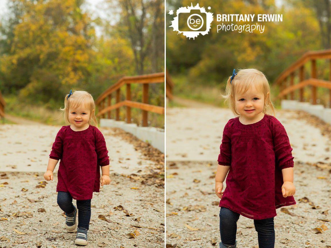 Indianapolis-portrait-photographer-little-girl-playing-outside-fall-on-bridge.jpg