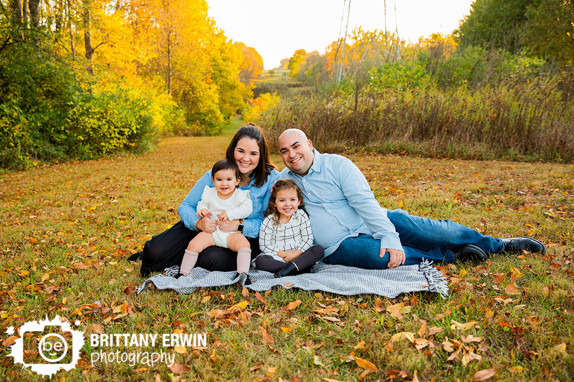 outdoor-fall-family-portrait-photographer-group-on-blanket-sisters-couple.jpg