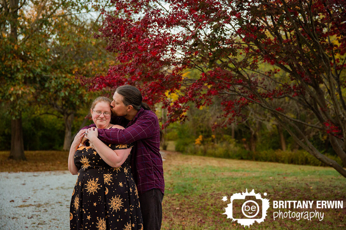 fall-engagement-portrait-photographer-couple-on-path-with-red-japanese-maple-tree.jpg