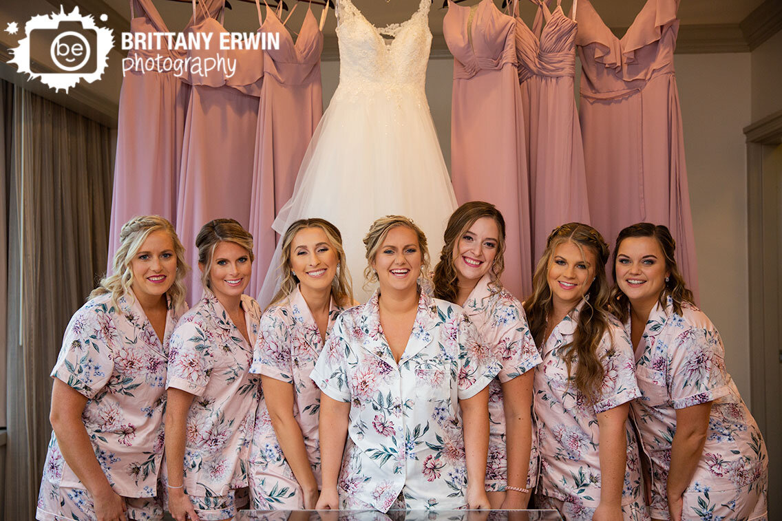 Downtown-hotel-Indianapolis-wedding-photographer-bride-bridesmaids-with-dresses.jpg
