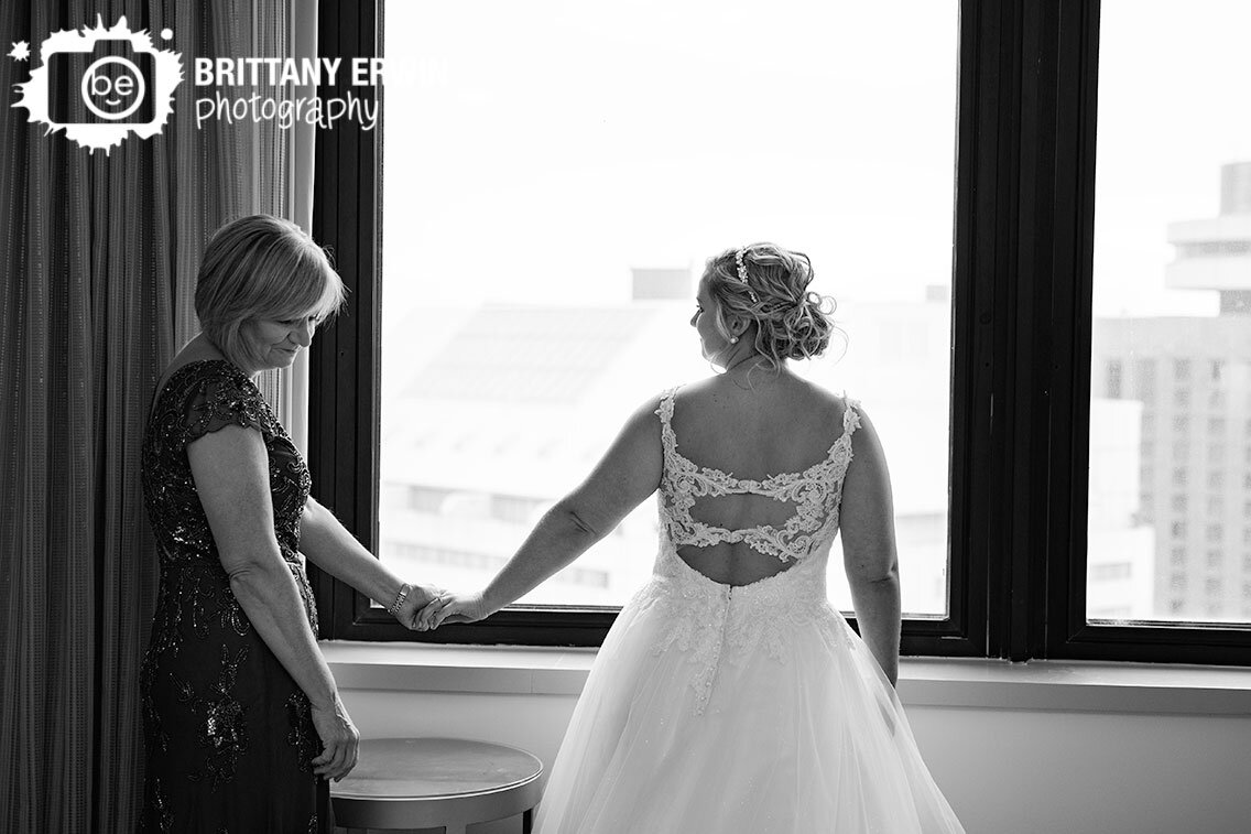 bride-getting-ready-with-mother-sweet-moment-after-putting-on-dress.jpg