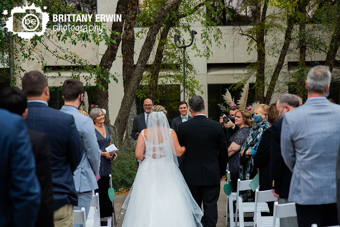 groom-and-mother-of-bride-reaction-as-bride-walks-down-aisle-with-father.jpg