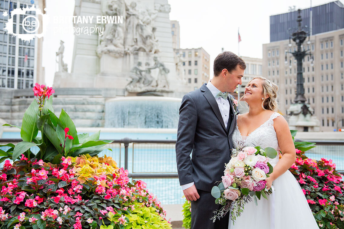 Indianapolis-downtown-bridal-portrait-couple-with-monument-circle-fountain-and-flowers.jpg