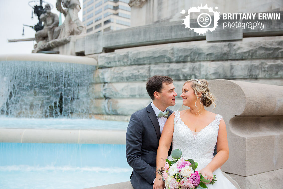 Downtown-Indianapolis-bridal-portrait-couple-on-monument-circle-with-fountain.jpg