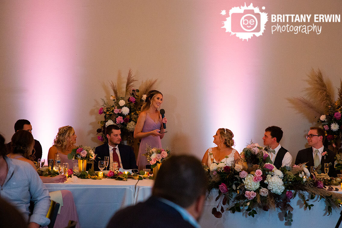 Indianapolis-wedding-reception-photographer-toast-by-maid-of-honor-at-head-table.jpg
