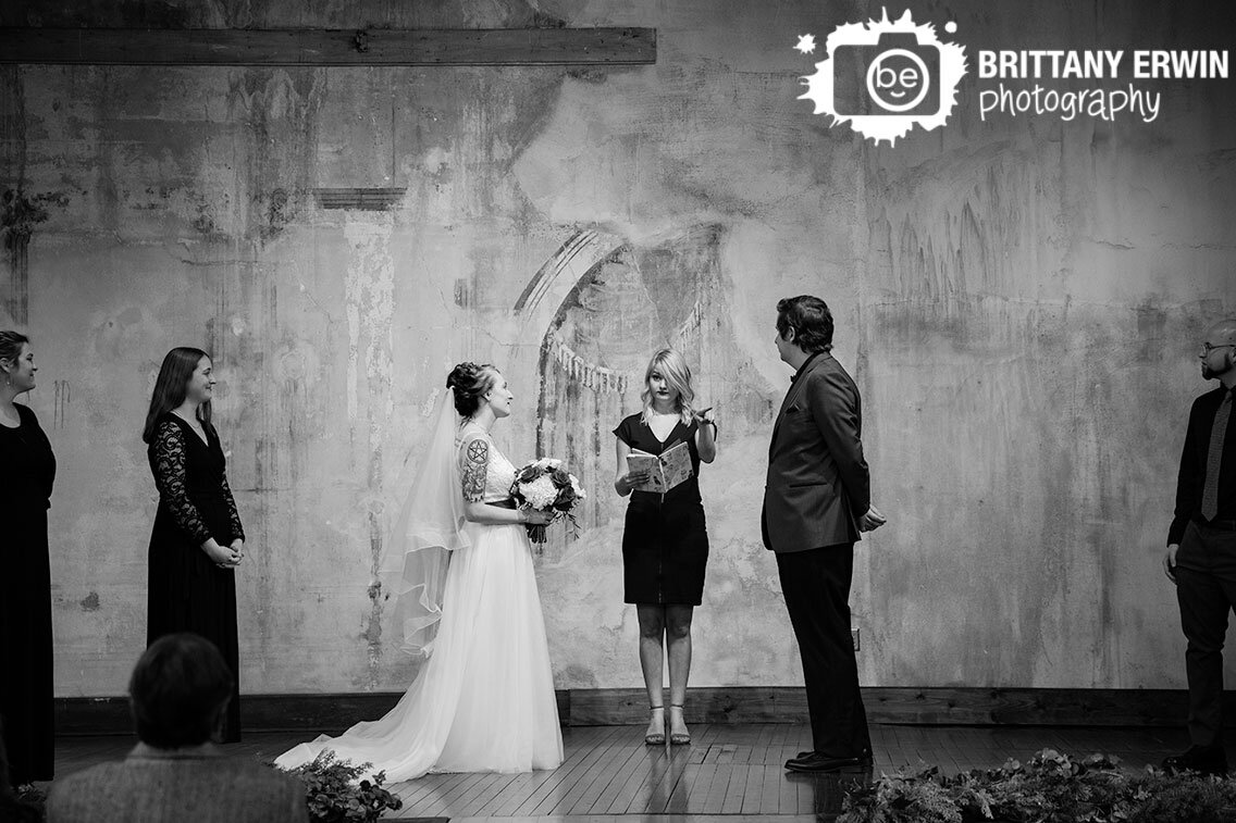 Indianapolis-wedding-ceremony-photographer-couple-on-stage-funny-officiant.jpg