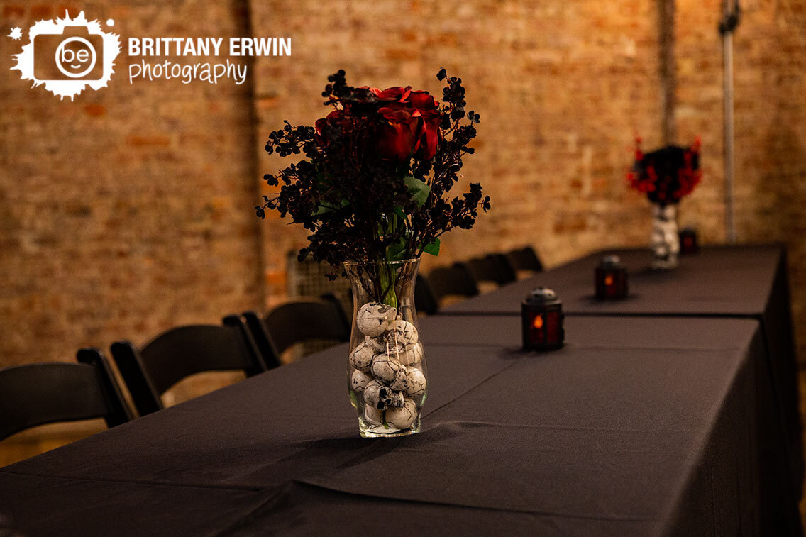 flowers-in-vase-with-skull-filler-on-black-table-wedding-reception.jpg