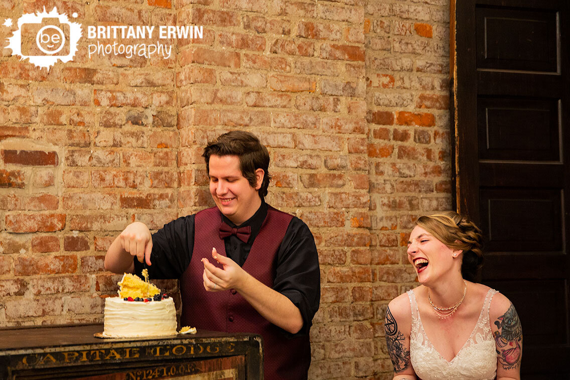 cake-cutting-bride-laughing-reaction-wedding-reception.jpg