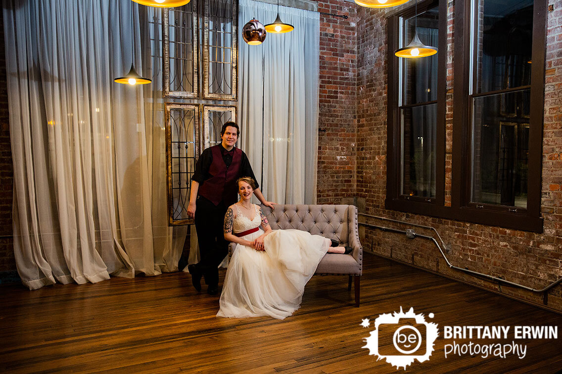 Neidhammer-events-wedding-venue-brick-walls-couple-with-vintage-window-art.jpg